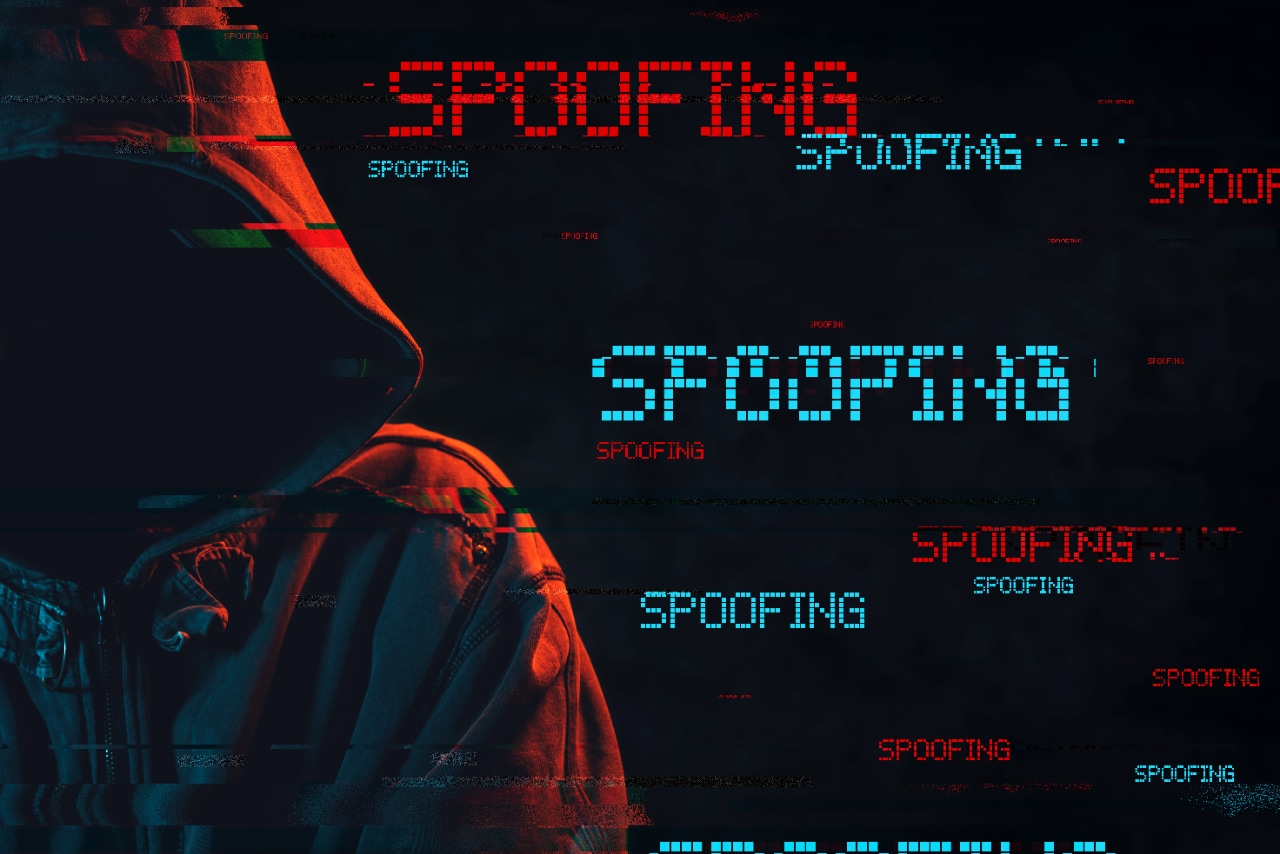 Spoofing concept with faceless hooded male person Spoofing concept with faceless hooded male person, low key red and blue lit image and digital glitch effect
