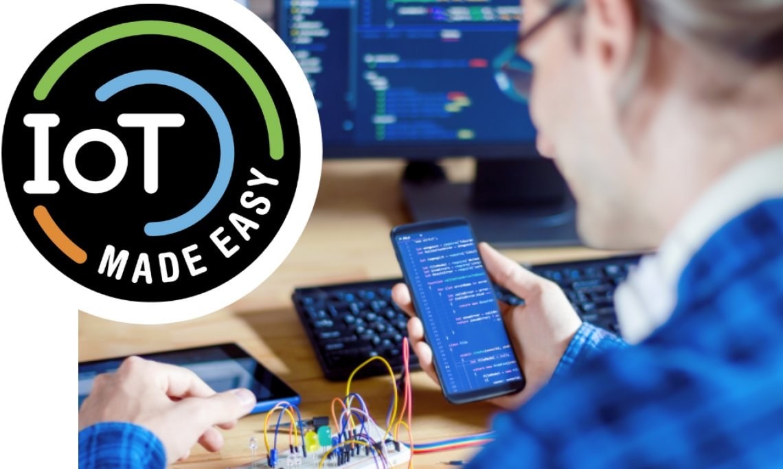 IoT Made Easy Badge With an Engineer Reviewing Code