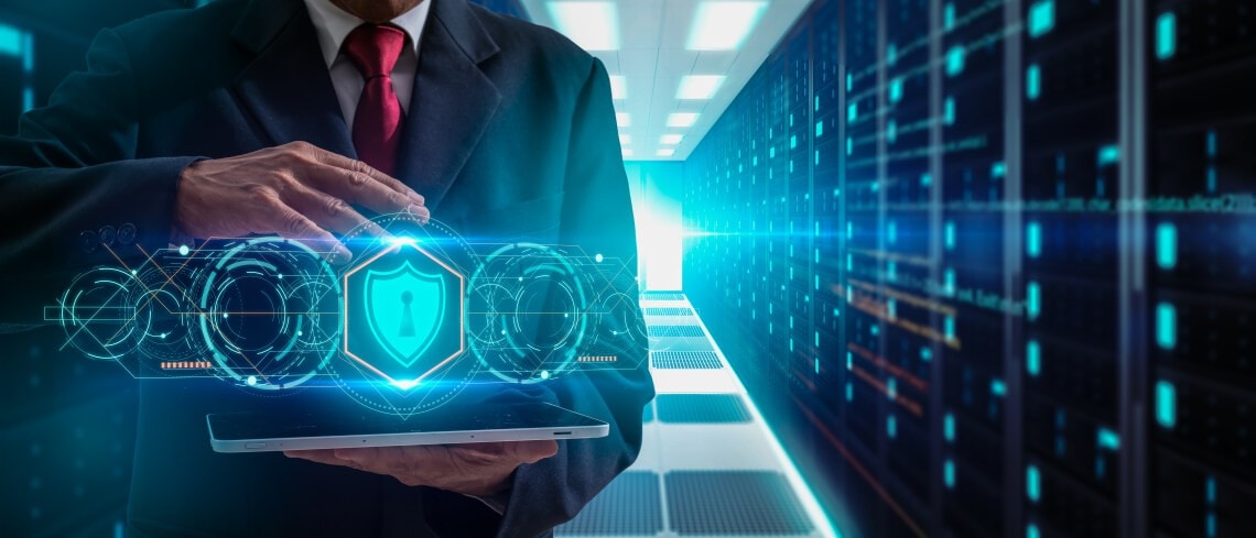Cyber Security Data Protection, precaution and security in business big data technology,Technology, Internet and network concept.businessman holding tablet and icon shield guard on server background.